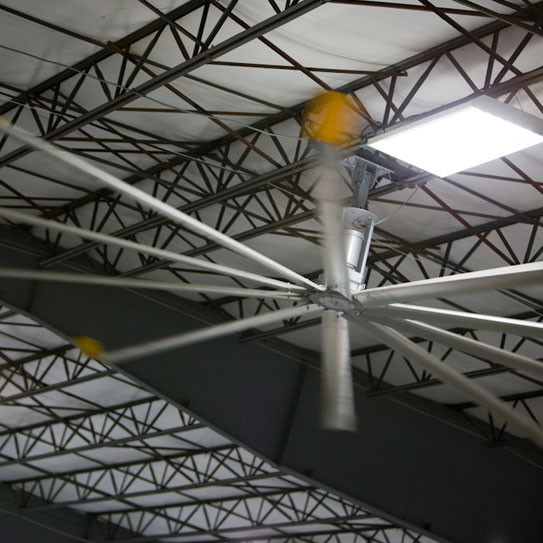 A large industrial ceiling fan made from Galvanized steel in a Majestic Steel warehouse.
