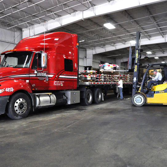 colored image of majestic associates loading the truck with galvannealed steel