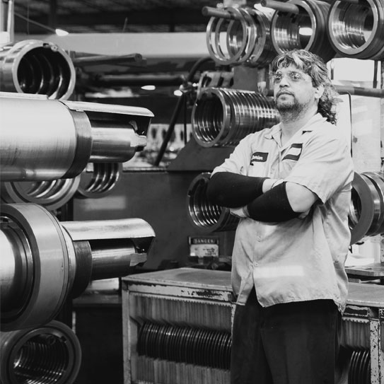 black and white image of a majestic steel associate crossing his arms