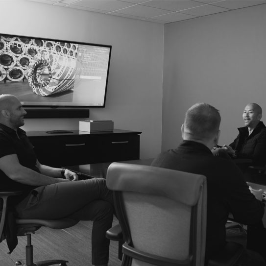 black and white image of majestic steel associates in a conference room