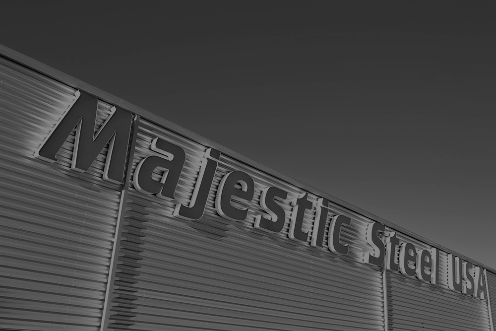 black and white image of majestic steel usa signage